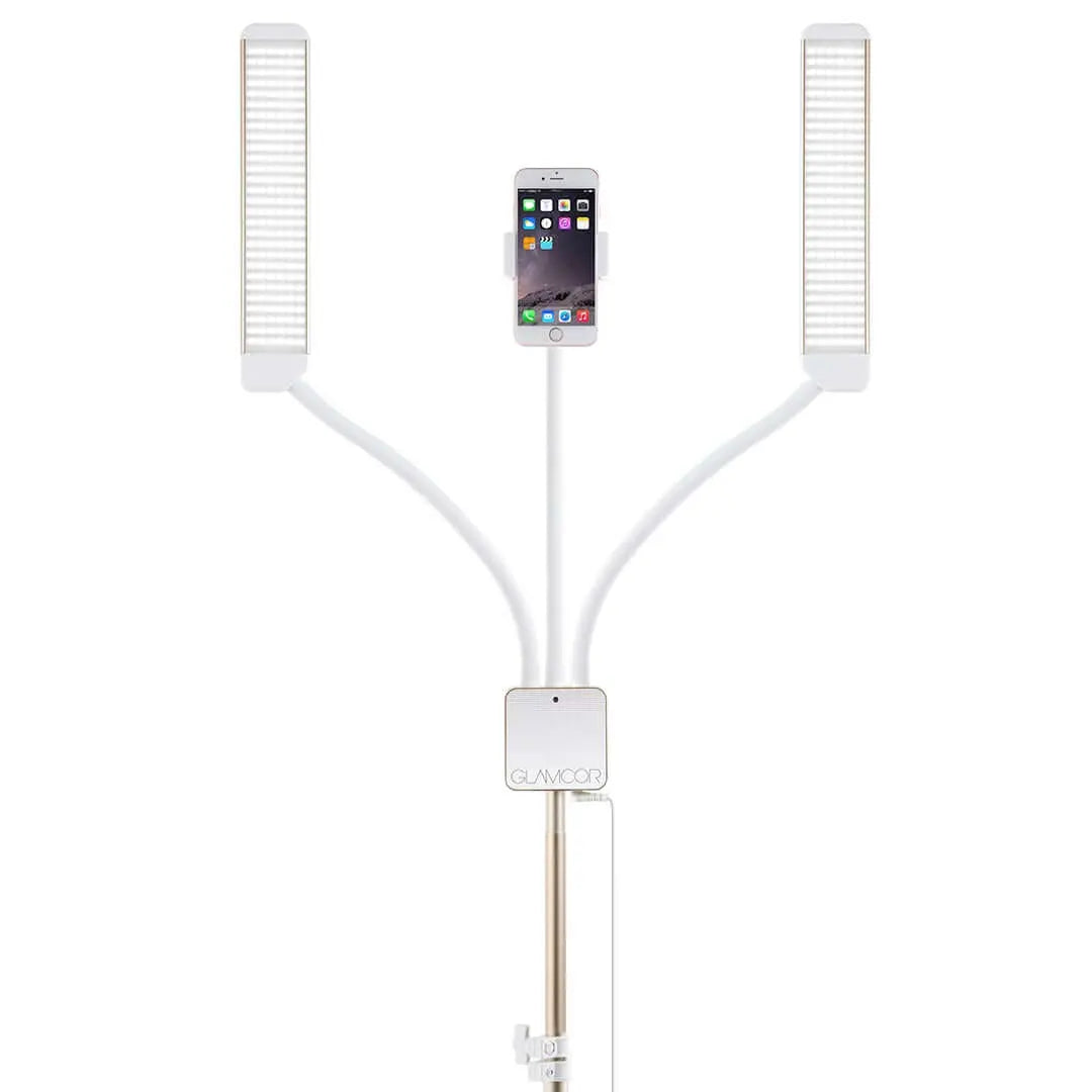 The Glamcor Universal Phone Clip in white attached to the Multimedia X light kit. This image showcases the clip's secure hold on a phone and its ease of use with the Multimedia X, emphasizing its adjustable and rotatable features.