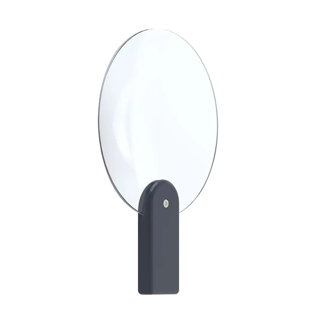 Esthetician using the Glamcor Magnifying Glass Accessory for precise beauty treatments