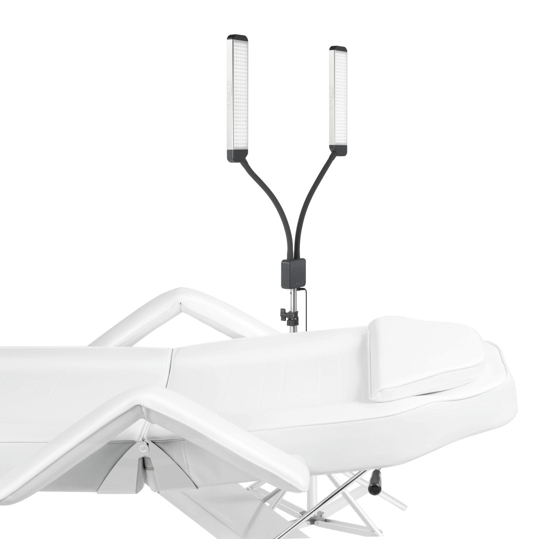 Esthetician using the Elite X Floor Light Kit with flexible luminary for detailed lash work.