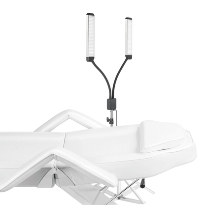 Esthetician using the Elite X Floor Light Kit with flexible luminary for detailed lash work.