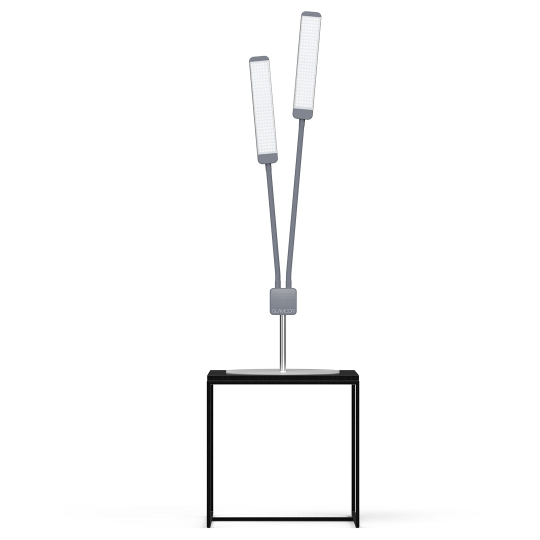 Dual flexible arms of different lengths on the GLAMCOR REVOLUTION X Table Top Light Kit for versatile positioning.