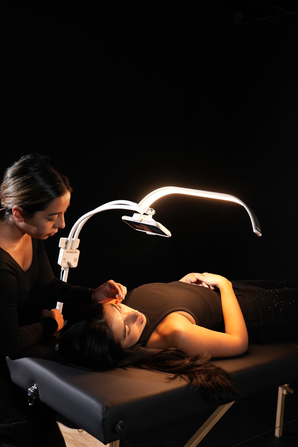 HORIZON with the phone on the media arm over a treatment bed