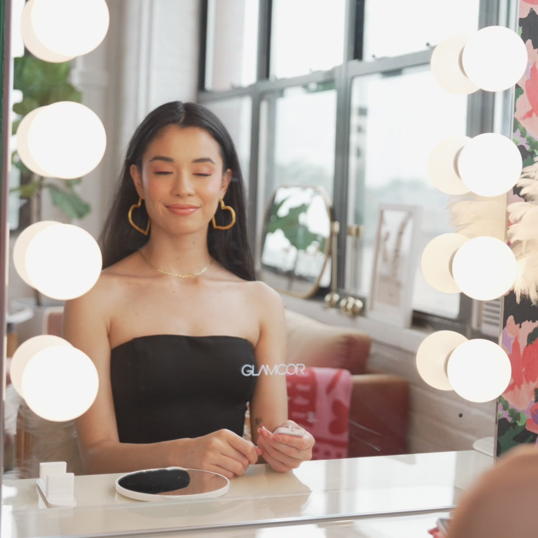 Riki Hollywood Mirror illuminating a beauty routine, perfect for flawless makeup application and selfies.