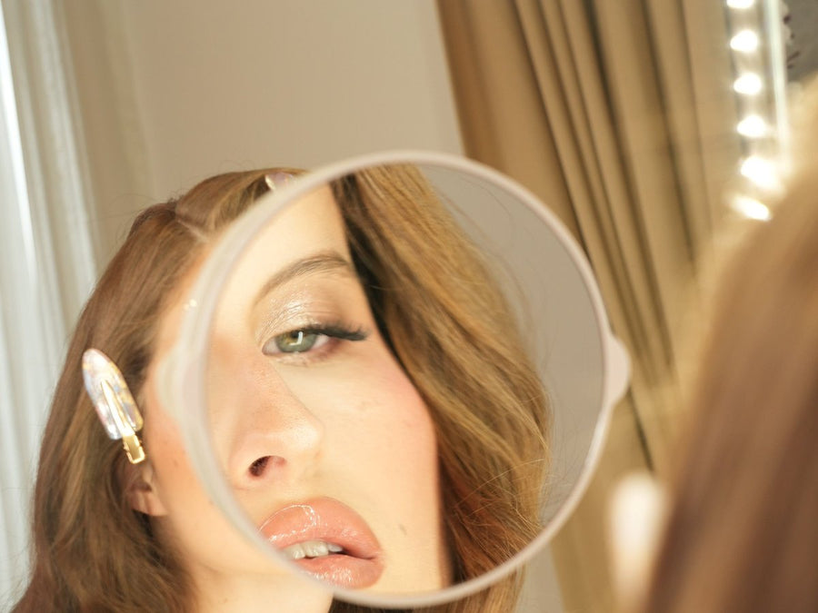 Close-up makeup check in the 5x magnifying mirror