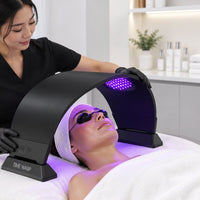 Esthetician using TIME WARP Tri-Light on a client