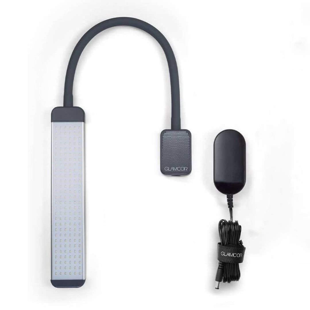 Flexible arm design of the GLAMCOR REVEAL Table Top Light Kit for optimal illumination.