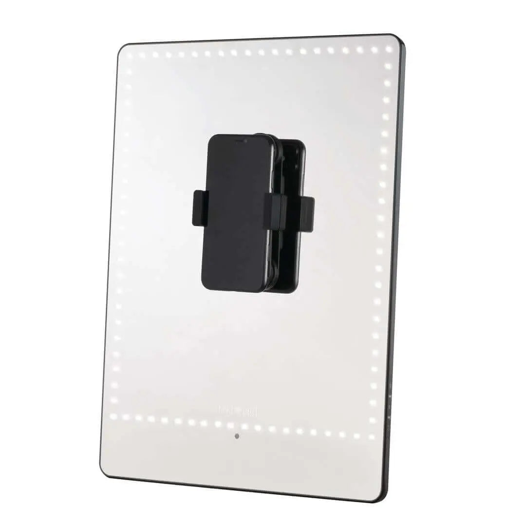 RIKI PRETTY illuminated LED mirror beside a computer for video calls